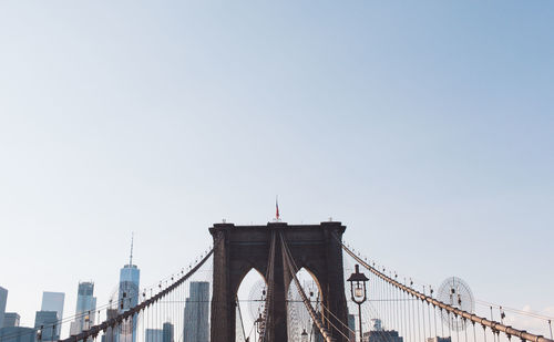 Low angle view of brooklyn bridge against clear sky