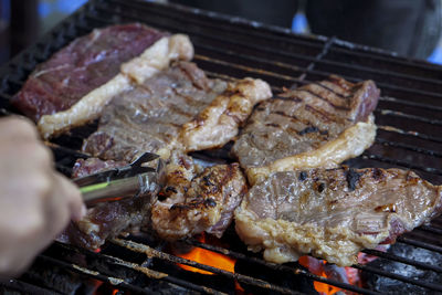 Close-up of meat on barbecue grill