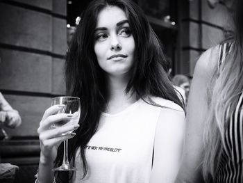 Close-up of young woman drinking glass