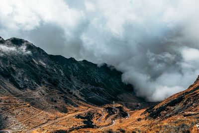 Scenic view of mountain against cloudy sky