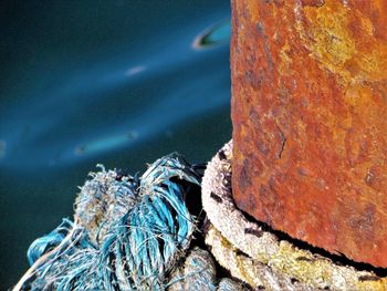 High angle view of rope tied to pier over sea