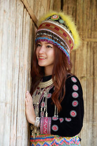 Portrait of smiling young woman in hat