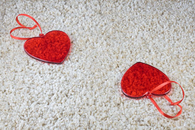Close-up of heart shape on sand