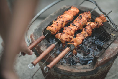 High angle view of meat on barbecue grill