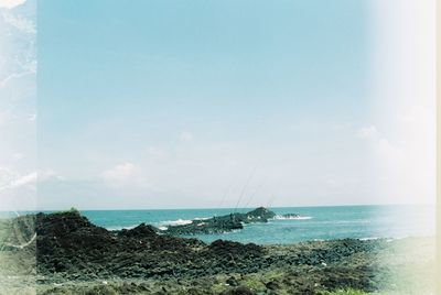 Scenic view of beach and sea against sky