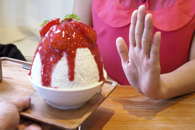 Close-up of hand holding ice cream