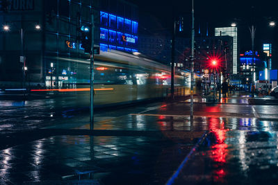 Blurred motion of cable car on street at night