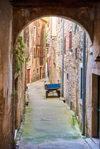 Alley with old houses and a trailer in skradin in croatia