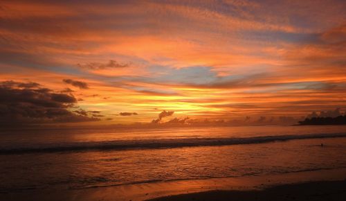 Scenic view of sea against orange sky