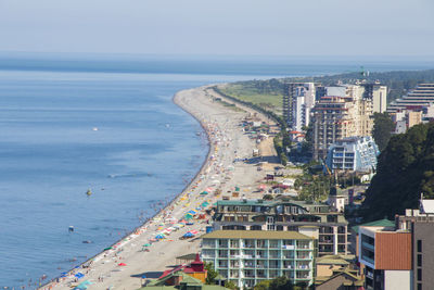 Sea beach, people during holidays in black sea, georgia