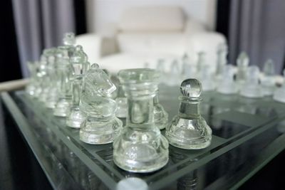 Close-up of chess pieces on table