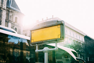 Low angle view of yellow building against sky