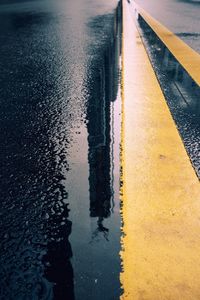 High angle view of puddle on road