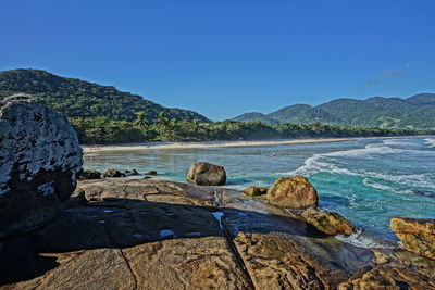 Scenic view of sea against clear blue sky