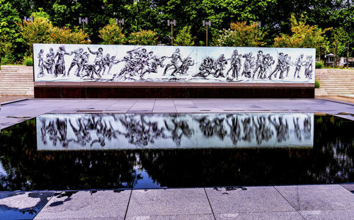 Graffiti on bench in park