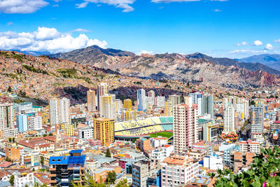 High angle view of city buildings against sky