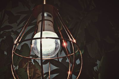 Low angle view of illuminated lights at night