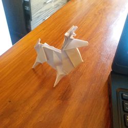 High angle view of bird on wooden table