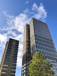 Low angle view of modern buildings against sky