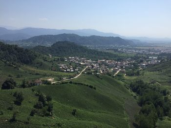 Scenic view of grassy mountains