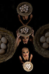 Multiple image of woman holding eggs in wicker basket