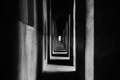 Empty narrow corridor of building