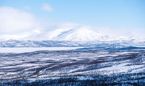 View over the mountains covered in snow in abisko nationalpark.