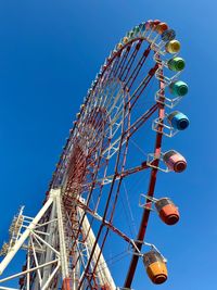 Low angle view of ferris wheel against clear sky in japan