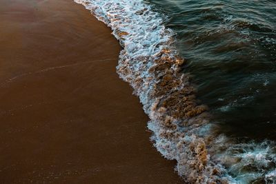 Waves reaching shore at beach