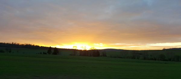 Scenic view of landscape against sky during sunset