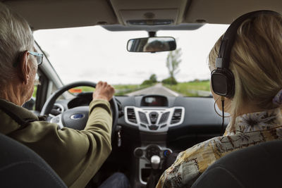 People sitting in car