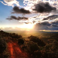 Aerial view of landscape against sky at sunset