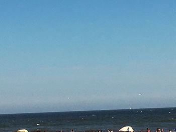 Scenic view of calm sea against clear sky