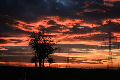 Silhouette of landscape against dramatic sky