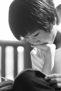 Close-up of boy reading