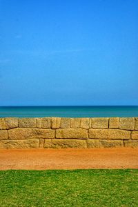 Scenic view of sea against clear blue sky