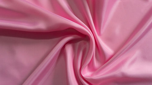 Beige silk fabric texture. satin background