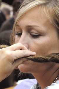 Close-up of woman holding hair