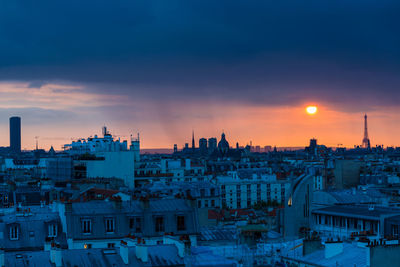 Cityscape against sky during sunset