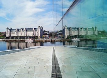 Bridge over river with buildings in background