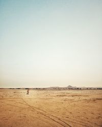 Scenic view of desert against clear sky