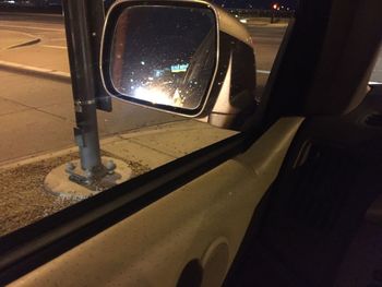 Reflection of car on side-view mirror