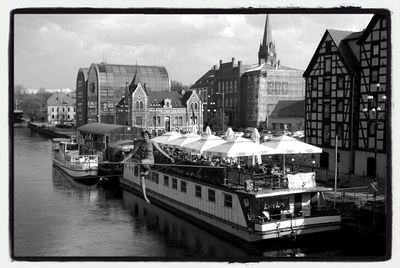 Boats moored in canal