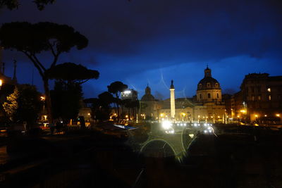 View of illuminated street lights at night