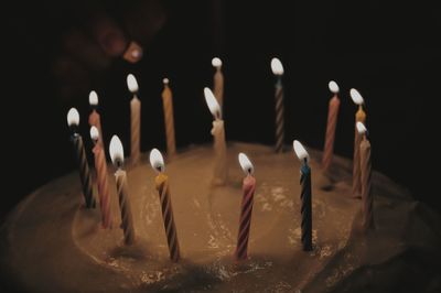 Close-up of illuminated birthday cake