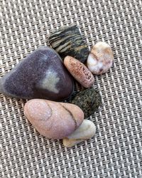 High angle view of pebbles on wicker seat