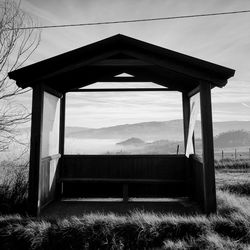 Built structure on field against sky