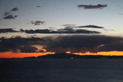 Scenic view of silhouette mountain against sky at sunset