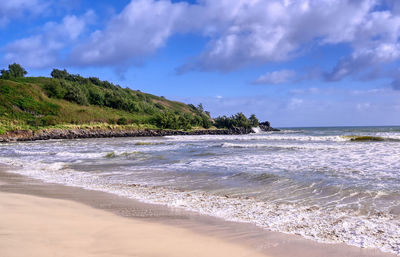 Scenic view of beach against sky