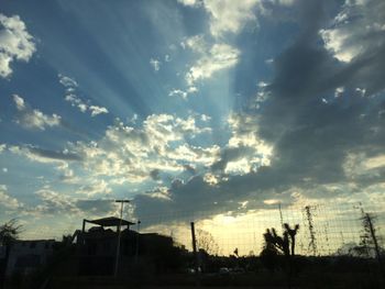 Low angle view of cloudy sky at sunset